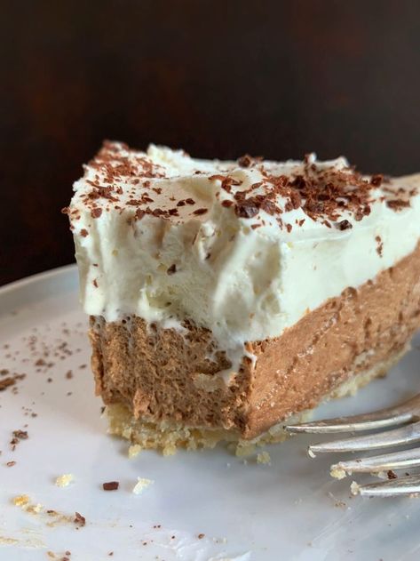 A slice of chocolate chiffon pie with freshly whipped cream and chocolate shavings on top on a white dessert plate. My Country Table, Chiffon Pie, Chocolate Pie Recipes, Holiday Baking Recipes, Country Table, Holiday Recipes Christmas, Chocolate Pies, Delicious Pies, Frozen Desserts