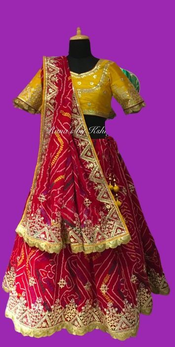 Red Bandhani Lehenga in Pearl Gota. Red pure hozariya chundri lehenga chunni set with contrast and bright yellow pure raw silk blouse. The chundri lehenga has a beautiful geometric and floral design design all over the ghera of the lehenga. The rich fine gota design on the base in gota and pearl handwork looks very rich and beautiful. The lehenga is teamed with a pretty odhna in chundri (bandhani - hand tie and dye). The four sides has beautiful design with both pallus as heavy as the lehenga ba Red Bandhani Lehenga, Blouse Design Wedding, Bandhani Lehenga, Raw Silk Blouse, Wedding Lehenga Designs, Design Design, Raw Silk, Bright Yellow, Silk Blouse