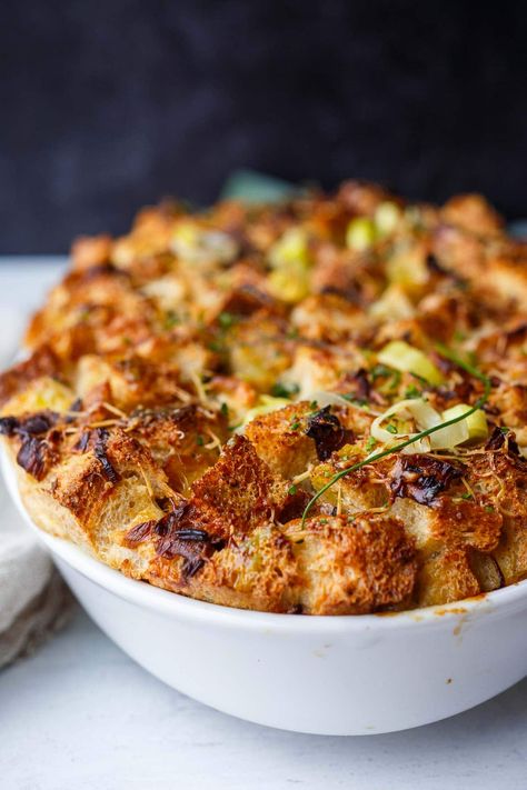 This Savory Bread Pudding with leeks and gruyere is as cozy as it gets!  A delicious and comforting side dish or vegetarian main- perfect for special dinners or the holiday table. (Adapted from Thomas Keller's recipe- but a little lighter!) Leek Recipes Side Dishes, Leek Bread Pudding, Leek Bread, Thomas Keller Recipes, Savory Bread Pudding, Winter Side Dishes, Savory Bread Puddings, Bouchon Bakery, Leek Recipes