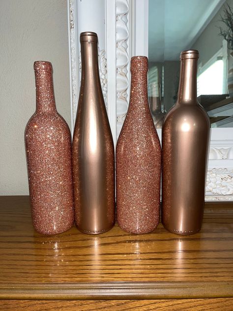 ABOUT THIS SET! -These bottles are empty glass wine bottles. All bottles are 750 ml. -This listing/price includes 4 bottles. If you would like less or more this is an option just message me before hand and let me know and I can make you a separate listing!  -These bottles consist of 2 rose gold glitter and 2 plain rose gold! All 4 bottles are coated with EPOXY, this means they do have a smooth finish and no glitter shed! The Epoxy gives all the bottles a more durable finish.  -These bottles are all different shapes and sizes, I pick these at Random and try to make them all different. If you have a preference let me know!  If you would like all of the bottles to be the same shape and size please just let me know   -All bottles are made to order so they can be made in other colors and person Rose Gold Wine Bottle Centerpieces, Wedding Wine Bottle Centerpieces, Wine Bottle Wedding Centerpieces, Rose Gold Centerpiece, Wedding Wine Bottle, Rose Gold Party Decor, Wine Bottle Centerpieces, Wedding Wine Bottles, Bottle Centerpieces