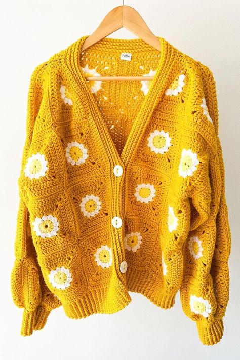 Front view of a mustard yellow crochet cardigan with granny squares and daisy patterns, featuring a cozy boho chic style. Yellow Granny Square, Crochet Sweater Pattern Easy, Granny Square Crochet Cardigan, Crochet Sweater Design, Woolen Sweaters, Square Crochet, Granny Squares Pattern, Crochet Jacket, Crochet Cardigan Pattern