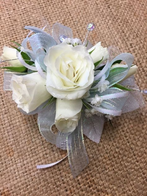 Light Blue And White Corsage And Boutonniere, Blue White And Silver Corsage, Periwinkle Corsage Prom, White And Blue Flower Boutonniere, Prom Crossage Ideas Blue, White Corsage And Boutonniere Set, Corsage With Blue Dress, Light Blue Flower Bouquet Prom, Baby Blue Corsage And Boutonniere