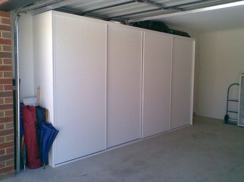 Garage Sliding Storage, Sliding Door Garage Storage, Garage Storage Sliding Doors, Garage Shelf With Sliding Doors, Garage Closed Storage Ideas, Garage Sliding Door Storage, Garage Cabinet Organization Ideas, Storage Curtain, Storage In Garage