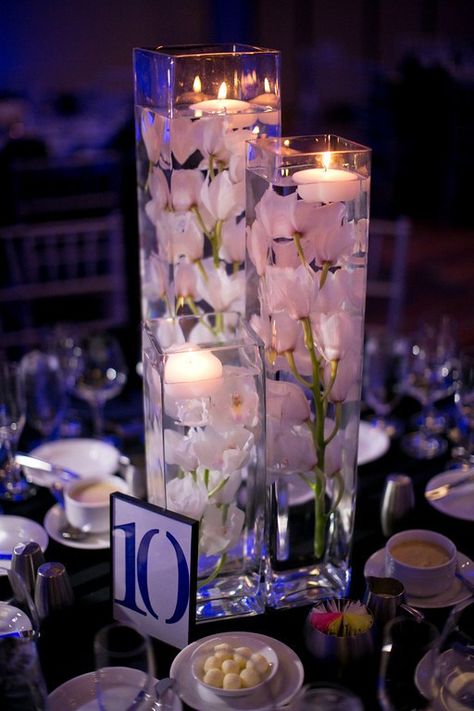 clear vase centerpieces ideas | 37 Floating Flowers And Candles Centerpieces - Shelterness Simple Wedding Centerpieces Diy, Simple Wedding Centerpieces, Silk Orchids, Unique Wedding Flowers, Wedding Floral Centerpieces, Floating Flowers, Wedding Centerpieces Diy, Flower Centerpieces Wedding, Candle Centerpieces