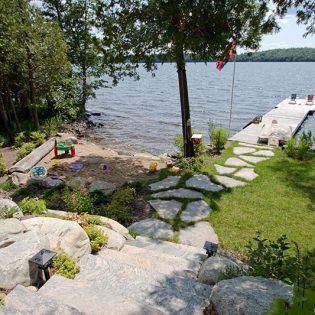 Gallery - Lakeside Landscaping - Muskoka Landscaping Contractor Lakeside Landscaping, Lake Landscape Design, Nautical Landscaping, Lake Landscaping, Lakeside Garden, Sloped Backyard Landscaping, Cottage Backyard, Lake Houses Exterior, Lake Dock