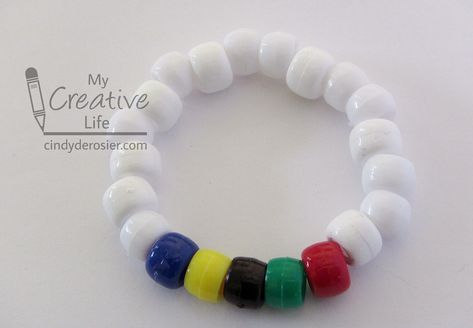 This easy pony bead bracelet is inspired by the Olympic flag. It’s a fun craft to do while watching the … Camp Olympics, Olympic Vbs, Summer Olympics Crafts, Vbs Olympics, Gymnastics Camp, Olympic Idea, Kids Olympics, Olympic Crafts, Olympic Flag