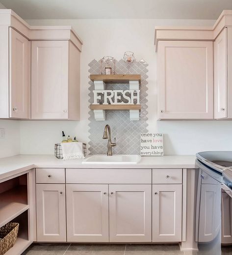 Blush Cabinets Bathroom, Blush Pink Laundry Room Cabinets, Blush Cabinets Kitchen, Blush Pink Cabinets, Pink Painted Cabinets, Pink Laundry Room Cabinets, Pale Pink Cabinets, Light Pink Cabinets Bathroom, Laundry Room With Pink Cabinets