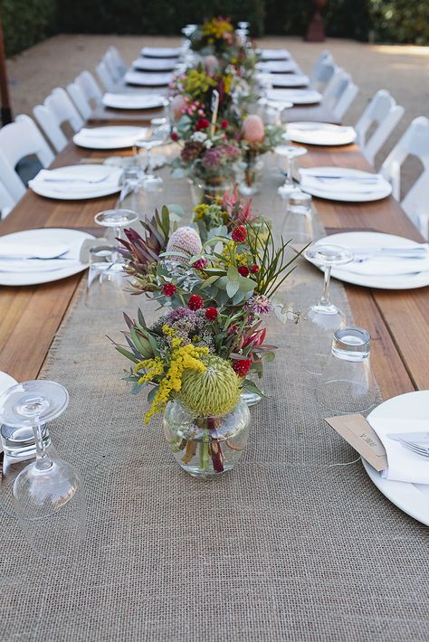 Photography: Its Beautiful Here - its-beautiful-here.com/ Beautiful natives table centrepiece Read More: http://www.stylemepretty.com/australia-weddings/2014/06/30/diy-victoria-wedding-at-euroa-butter-factory/ Factory Wedding, Diy Wedding Table, Party Table Centerpieces, Aussie Christmas, Australian Christmas, Victoria Wedding, Australian Native Flowers, Table Setting Decor, Christmas Lunch