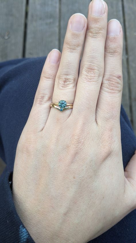 Teal montana sapphire engagement ring with curved blue diamond wedding band Blue Diamond Wedding Band, Montana Sapphire Engagement, Montana Sapphire Engagement Ring, Montana Sapphire, Sapphire Engagement Ring, Diamond Wedding Band, Sapphire Engagement, Engagement Rings Sapphire, Blue Diamond