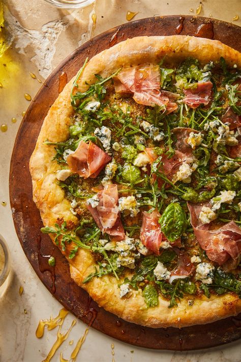 Pesto Prosciutto Pizza is a dreamy homemade pizza made with fragrant basil pesto, garlic, fresh greens, savory prosciutto, crumbled blue cheese and our Italian Pizza Dough Kit. Prosciutto Pizza Recipes, Cast Iron Pizza Recipe, Gourmet Pizza Recipes, Pizza With Pesto, Perfect Homemade Pizza, Pesto Pizza Recipe, Basil Pizza, Pizza Oven Recipes, Prosciutto Pizza