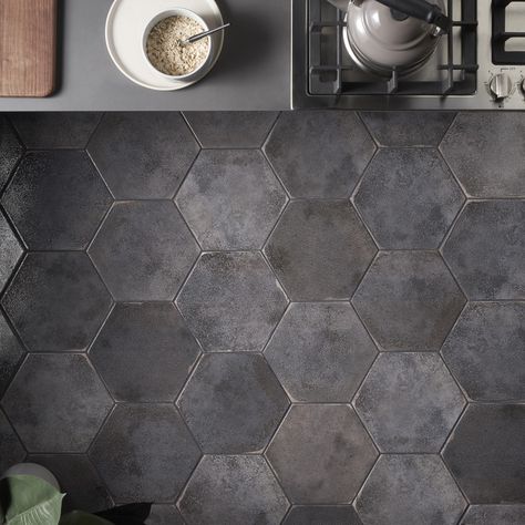 Kalay Antracite 9" Hexagon Polished Porcelain Tile, Gray, Backsplash, Wall and Floor. About The Tile: The Kalay Antracite 9" Hexagon Polished Porcelain tile features a neutral charcoal gray shade with a polished textured finish and worn edges, creating a soft rustic look with contemporary sensibility. The use of chameleon ink creates subtle and reflective color variations while the 20 different faces reinforce an artisanal look of this versatile hexagon format. Modern rustic glazed porcelain til Hexagon Tile Bathroom Floor, Hexagon Tile Bathroom, Black Hexagon Tile, Artmore Tile, Black Tile Bathrooms, Gray Backsplash, Hexagon Tile Floor, Kalay, Grey Floor Tiles