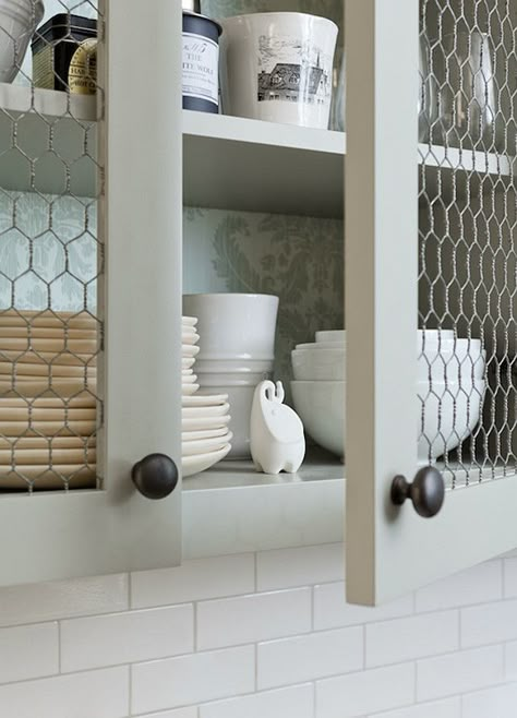 Kitchen with Chicken Wire Cabinet Doors. This kitchen boasts upper cabinets, with backs of shelves lined with gray damask wallpaper, accented with chicken wire doors.  Jenny Wolf Interiors. Chicken Wire Cabinets, Kitchen Diy Ideas, Diy Kitchen Ideas, Cheap Kitchen Cabinets, Cabinet Plans, Kitchen Cabinets Ideas, Farmhouse Kitchen Cabinets, Diy Kitchen Remodel, Kitchen Cabinet Door