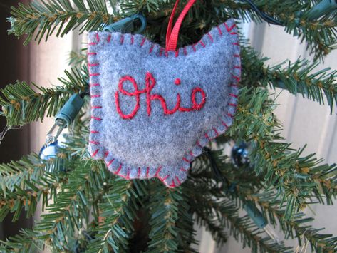 Celebrate Buckeye pride with this adorable Script Ohio ornament. Gray with red lettering, lightly stuffed with fiberfill. Completely hand-stitched. Ohio State Diy, Ohio Ornament, Ohio State Ornaments, Cheap Ornaments, Buckeye Baby, State Pillow, State Ornaments, Felt Ideas, Felt Ornament