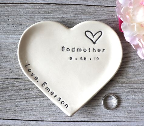 "This large heart dish makes a sweet Godmother gift or gift from godchild. You can give this to her at the baptism, Christmas, birthday or any occasion in-between. This attractive ring dish features the word \"Godmother\" and a heart.   You can personalize this item with your special name and a date. These handmade, hand-glazed dishes make unique gifts for a baptism or birthday.  Your loved ones will enjoy this quality handmade gift for years to come. Our large sized heart dish can accommodate m Baptism Ideas Girl, Baptism Gifts For Baby Girl, Baptism For Girl, Christening Ideas Girl, Baby Baptism Party, Godmother Gift Ideas, Godparent Request Ideas, Godmother Gifts Baptisms, Baptism Birthday Party