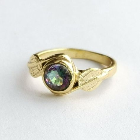 Mystic Topaz Fancy Round Cut Ring In Leaf Design In 14k Gold Fill Over Sterling Silver Stamped 925 Size 6 Mystic Topaz In This Ring Appears In Purple To Green Tones. Generally, The More Facets The Stone Has, The More Colours It Displays, And For That Reason The Fancy Cuts Are Often Used. Here The Topaz Is Round Cut, With Nice Reflections. I Have Attempted To Take Pictures From Several Angles To Best Display This Feature. Round Cut Ring, Big Stone Ring, Mystic Topaz Ring, Turquoise Ring Silver, Silver Wedding Rings, Mystic Topaz, Green Tones, Quartz Ring, Topaz Ring