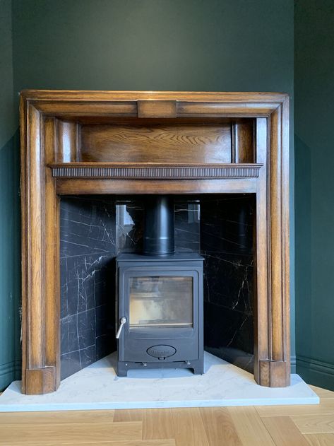 Wooden Fire Surrounds, Wood Burner Stove, Woodburning Stove Fireplace, Pr Gift, Wooden Fireplace Surround, Black Marble Tile, 60s House, Stone Hearth, Log Fire