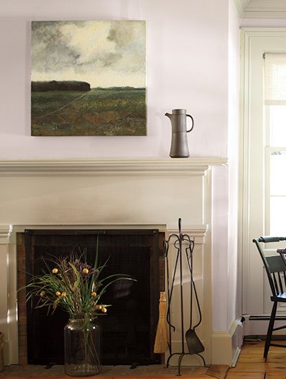 Light mauve walls with a scenic photo hung above a tan fireplace mantel. Tan Fireplace, French Countryside Decor, Color Palette Benjamin Moore, French Country Paint Colors, Country Paint Colors, Cottage Paint Colors, Soft Landscape, Mauve Walls, Countryside Decor