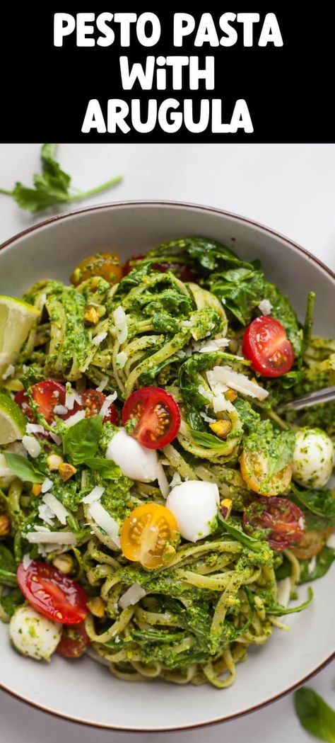 An easy, healthy and tasty vegetarian bowl of pasta tossed with fresh pesto, arugula / rocket leaves, juicy cherry tomatoes and soft mozzarella. Make my favorite pistachio lime pesto or a more classic basil pesto - the choice is yours! Arugula Pesto Pasta, Pesto Recipes Dinner, Pesto Arugula, Vegetarian Bowl, Pesto Linguine, Pasta With Arugula, Pasta With White Beans, Pesto Risotto, Arugula Pasta