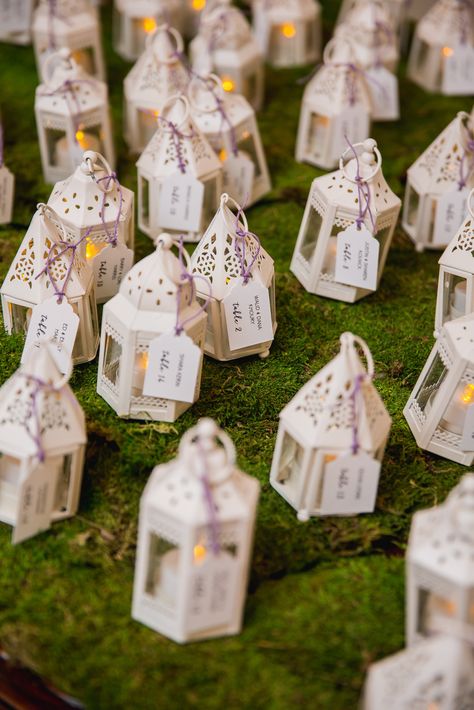 Mini lanterns triple duty: Table lanterns, decor and favors! #Miller2Lyons Lantern Party Favors, Mini Lanterns Wedding, Fairy Wedding Theme, Water Centerpieces, Lantern With Fairy Lights, Lantern Wedding, Lantern Decor Wedding, Table Lanterns, Mini Lanterns