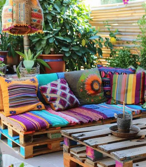 Transform Your Backyard into a Boho Paradise: 12 Enchanting Design Ideas - NEKIG :COASTALCHARM BLOG Bohemian Backyard Decor, Boho Couches, Bohemian Backyard, Mismatched Chairs, Repurposed Decor, Rustic Fire Pits, Balcony Design Ideas, Sunrooms, Colourful Cushions