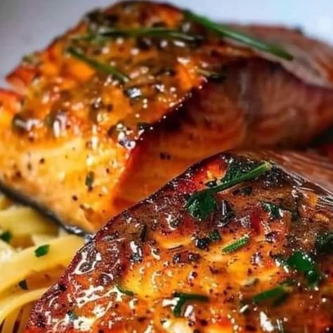 Chef zouheir on Instagram: "Salmon with Cajun Butter Sauce:  Ingredients: For the Salmon: 4 (6 oz.) skinless salmon fillets 2 tbsp olive oil 1 tsp salt 1 tsp garlic powder 1 tsp onion powder 1 tsp smoked paprika 1 tsp dried oregano 1 tsp dried thyme 1/2 tsp black pepper 1/4 tsp cayenne pepper 1 lemon, juiced For the Cajun Butter Sauce: 6 tbsp butter 1 tbsp honey 4 garlic cloves, minced 1/2 cup chicken broth 1 cup heavy cream 1 tbsp cornstarch 1/2 cup diced tomatoes 1 tbsp lemon juice 1/2 cup grated Parmesan cheese Fresh parsley, chopped (optional, for garnish) Instructions: Prepare the Salmon:  Pat the salmon fillets dry and brush them with olive oil. Mix together the salt, garlic powder, onion powder, smoked paprika, dried oregano, dried thyme, black pepper, and cayenne pepper. Rub this s Salmon With Cajun Butter Sauce, Cajun Butter Sauce, Kale And Bean Soup, Cajun Salmon, Cajun Butter, Dried Thyme, Garlic Butter Sauce, Fish Recipe, Diced Tomatoes