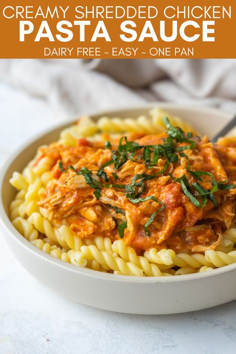 Creamy chicken pasta sauce on a bowl of noodles with fresh basil on top. Chicken Pasta Dairy Free, Chicken Pasta Red Sauce, Chicken Pasta Sauce Recipes, Shredded Chicken Pasta, Creamy Shredded Chicken, Pasta Sauce Dairy Free, Creamy Tomato Pasta Recipes, Chicken Pasta Sauce, Red Sauce Pasta Recipe