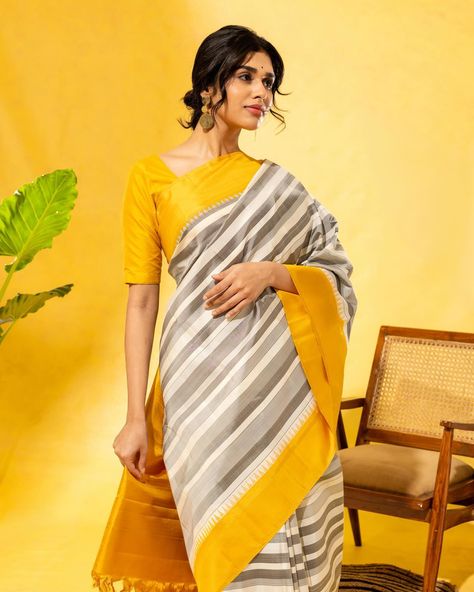 Savita | Shine of the Summer The handwoven Kanchipuram silk saree has White and black stripes over the body and a yellow bodi border. Kanchipuram sarees for every occasion! [Summer Collection, Kanchipuram silk saree, Tulsi Silks, Tulsi, Tulsi Weaves, Kanjeevaram Pattu, Kanchipuram, Pure Silk Sarees, Handwoven silk saree, Trending silk saree, bridal silk saree] Black Organza Saree, Saree Trending, Silk Saree Bridal, Tulsi Silks, Kanjeevaram Silk Saree, Ikat Blouse, Shibori Sarees, Organza Silk Saree, Chanderi Silk Saree