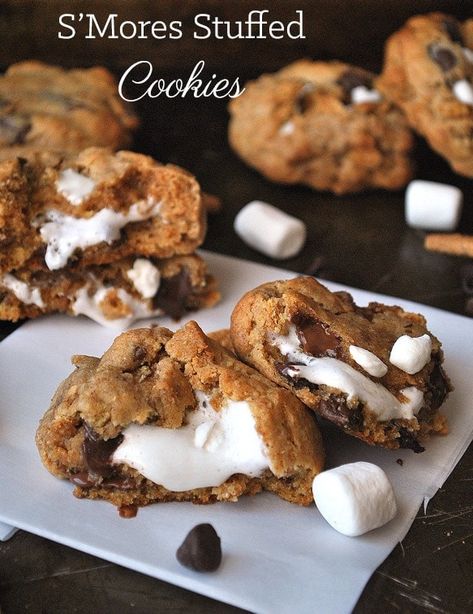 There is nothing better than a gooey s'mores stuffed cookie. They'll be the best part of your day! #smores #stuffedcookies #cookierecipes Stuffed Cookies, Smores Cookies, S'mores, Chewy Cookie, Cookies Recipes Christmas, S Mores, Cookie Desserts, Yummy Cookies, Marshmallows