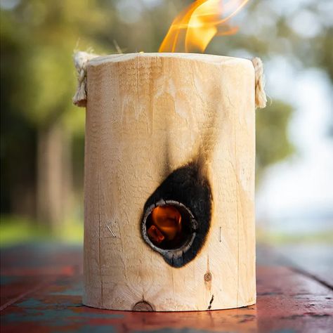 A Swedish Torch Is the Easiest Campfire Method | Epicurious Swedish Torch How To Make, Swedish Log Fire, Fire Logs Diy How To Make, Backyard Wood Projects, Wood Projects Outdoor, Wood Projects Garden, Garden Wood Projects, Swedish Torch, Swedish Fire Log