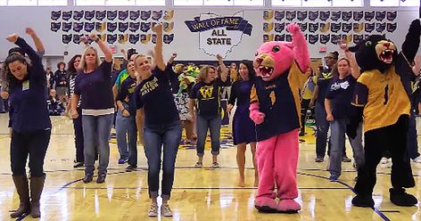 The students of Whitmer High School in Toledo, Ohio were in for a surprise during their recent pep rally. The principal was in the middle of his speech when music started to play over the speakers.   He immediately turned around to see what was going on and that's when a group of teachers stormed the gym floor. They started to dance in unison and that's when everyone realized it was a flash mob. I already thought this was pretty cool but as the song went on, more and more teachers joi... Pep Rally Games, Gym Floor, School Assemblies, School Testing, Pep Rally, Toledo Ohio, Flash Mob, Student Council, Gym Flooring