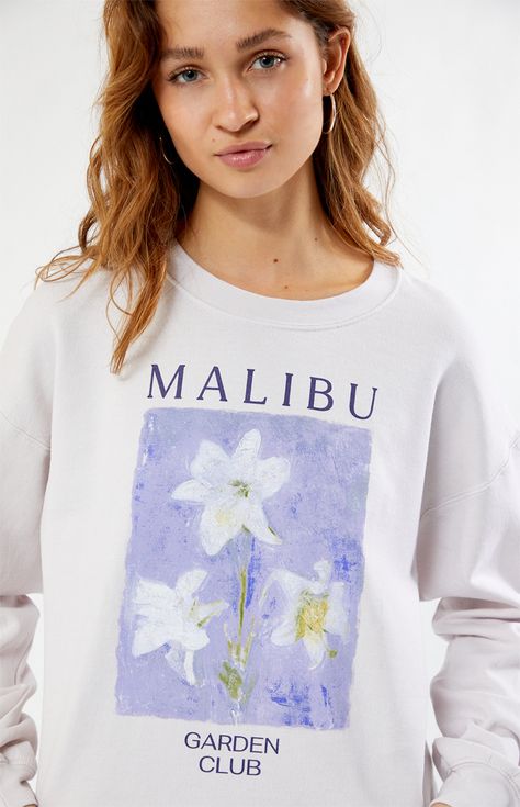 Cozy up in style with the Malibu Garden Club Crew Neck Sweatshirt from PS / LA. This laid-back yet chic piece features a relaxed fit and unique garden-inspired graphic on the front, making it the perfect choice for casual outings or lounging in comfort.   	Solid color sweatshirt 	Long sleeves 	Crew neckline 	Front graphic 	Ribbed trimming 	Oversized fit 	50% cotton, 50% polyester 	Machine washable 	Model is wearing a size XS/S 	Model measurements: 5’7” height, 32” bust, 24” waist, 34” hip Color Sweatshirt, Comfy Sweatpants, Baby Fits, Unique Gardens, Garden Club, Women Hoodies Sweatshirts, College Outfits, White Sweatshirt, S Models