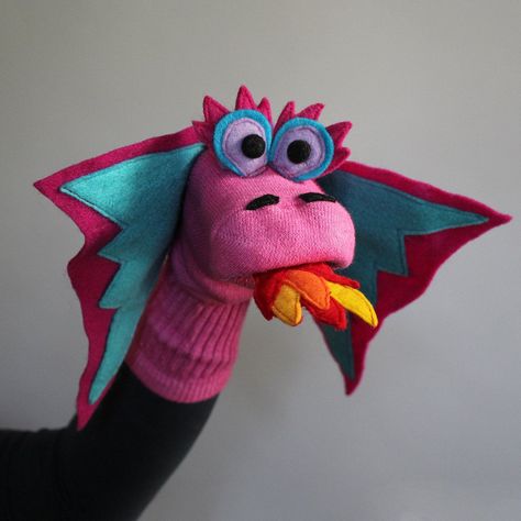 "Sockett® are carefully handcrafted and Made to Order.    \"Calliope\" our female Dragon sock puppet is wide eyed and flashy and a terrifically fun companion! Completely handmade on a genuine American cotton sock, strong stitching and glorious, colorful details highlight her 100% ecospun felt wings. Let your imagination soar with this inspired representation of the most beloved mythical creature of all time. Machine sewn for safety, strength & durability. Our felt is made in the USA from 100% po Puppet Workshop, Diy Sock Puppets, Handmade Puppet, Sock Puppet, Glove Puppets, Puppets For Kids, Puppets Diy, Sock Puppets, Puppet Patterns