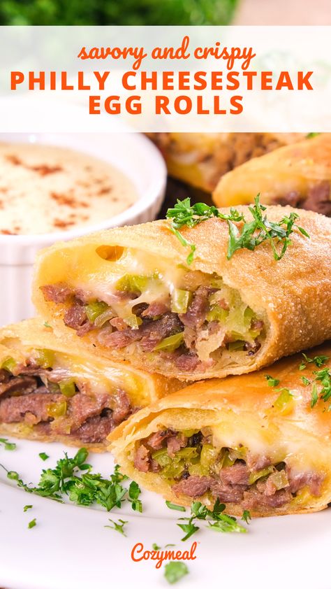 These Philly cheesesteak egg rolls combine a classic, savory cheesesteak filling with the crunch of an egg roll. Served with a cheesy provolone sauce, it’s the perfect crowd-pleasing appetizer. Egg Roll Filling Recipes, Rolled Dumplings Recipe, Egg Roll Sauce, Rv Snacks, Philly Cheesesteak Egg Rolls, Dumplings Recipes, Egg Roll Filling, Classic Savory, Egg Rolls Recipe