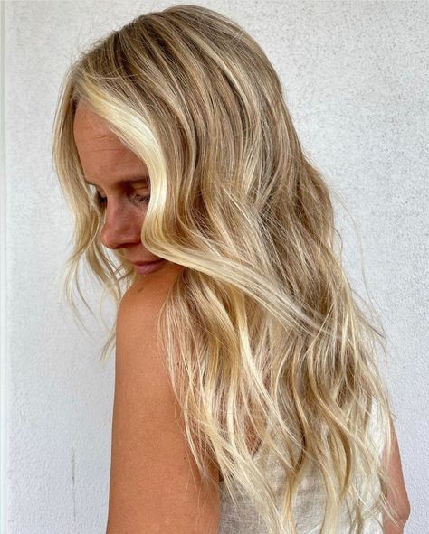 Beachy highlights have never been more attainable, thanks to balayage highlighting. The goal: sunny strokes of hair color that don't look too perfect and that hit those ultra-flattering spots. No matter your hair color or tone, there are beach highlights made just for you. Here are 26 ideas to take right to the salon. #beachyhighlights #highlights #haircolor #summerhair #beauty #southernliving Beachy Highlights, Sunflower Blonde, Cool Blonde Balayage, Warm Blonde Hair, Warm Brown Hair, Honey Balayage, Balayage Blond, Neutral Blonde, Warm Blonde