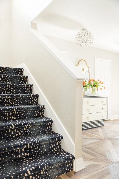 If I have said it once, I have said it a million times, that animal prints are neutral to me. I think animal prints can be used in almost any room to add another layer of pattern and texture. In this example, you can see a small peak of an antelope print carpet. This is a great way to add a pop of animal print to a space in a surprising and unexpected way. A standard builder basic set of stairs got the wow factor with the blue antelope print carpet. Stairway Carpet, Animal Print Carpet, Animal Magnetism, Built In Bookcase, Buying A New Home, Stair Runner Carpet, Carpet Stairs, Home Upgrades, Staircase Design