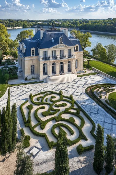 High angle view of a modern french mansion with dark blue roof ornate facade front garden with chrub maze marble pathways big river in the. Let’s reveal the charming features, quirky details, and luxurious elegance of French mansions. Manor House Exterior, Modern French Mansion, Blue Mansion, French Mansion, Cobblestone Driveway, Villa Ideas, French Chateau Style, Big Mansions, Chateau Style