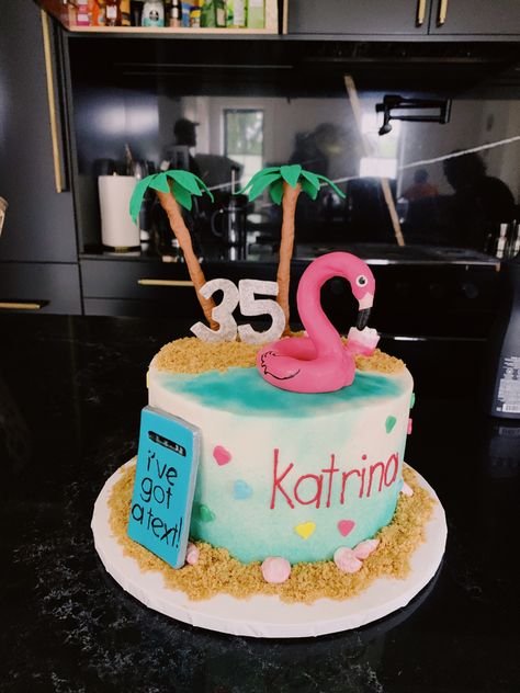 Colorful cake with love island branding. The cake has a beachy theme with a flamingo pool float and palm trees. With a cell phone on the side that says “I got a text”. Island Themed Cake, Love Island Cake, Love Island Party Ideas, Love Island Decorations, Love Island Themed Birthday Party, Love Island Bachelorette Party, Island Theme Cake, Love Island Birthday Party, Island Birthday Theme