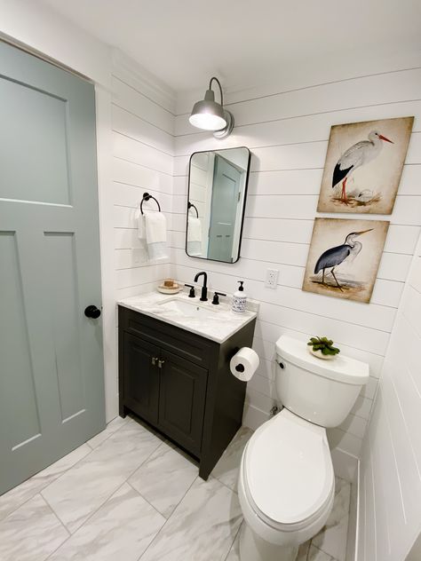 Renovated lake house bathroom using shiplap and hidden panel to hide utilities Lakehouse Bathroom Decor, Small Lake House Bathroom, Small Lake House Bathroom Ideas, Lake House Half Bathroom, Lake House Bathroom Ideas Small Spaces, Lake House Remodel Ideas, Lake Cottage Interiors Decorating Ideas, Lake Cabin Remodel, Lake Cabin Bathroom