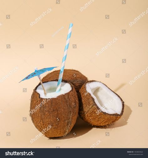 Coconut cocktail in a shell in the cup with an umbrella and a straw. The concept of a tropical holiday, summer m #Ad , #PAID, #cup#umbrella#straw#Coconut Coconut Cocktail, Tropical Holiday, Holiday Summer, Creative Portfolio, The Cup, Umbrella, Straw, Shells, Coconut