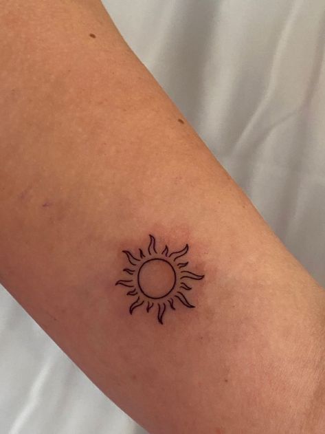 Unique & Cute Travel Tattoo Ideas For Women Sun Initial Tattoo, Cute Sun Tattoos Simple, Suntattoo Sun Tattoo Designs, Tangles Sun Tattoo, Sun On Wrist Tattoo, I Am The Sun Tattoo, Small Fine Line Sun Tattoo, Basic Sun Tattoo, Minimalist Sunshine Tattoo