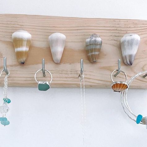 Sea Kissed By Kris • Handcrafted Jewelry on Instagram: "These Hawaiian Cone Shell Jewelry Holders are a cute way to organize + display your favorite beach bangles, rings, necklaces and earrings…and they’re $10 OFF now!! Shown Here Jewelry Holder Triple Sea Glass Earrings Sea Glass Ring Sea Glass Bezel Necklace Sunrise Shell Ring Beach Bangles Order Online www.seakissedbykris.com #jewelryholder #shellart #jewelryorganization #homeorganization #bedroomorganization #simplifylife" Shell Beads Jewelry, Jewelry Booth, Sunrise Shell, Artisan Market, Cone Shell, Sea Glass Ring, Jewelry Holders, Bezel Necklace, Sea Glass Earrings