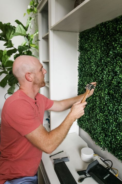 Want a faux boxwood wall of greenery for your home or as a backdrop for an event? Here is a step by step tutorial and how to video showing how to make one! #boxwood #boxwoodwall Grass Wall Bedroom, Live Plant Wall, Panel Accent Wall, Boxwood Wall, Wall Behind Tv, Boxwood Backdrop, Installing Wainscoting, Artificial Grass Wall, Faux Walls