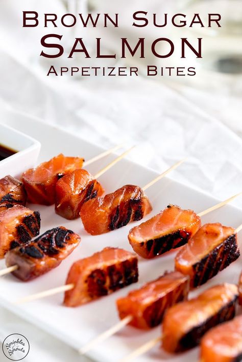 These cured brown sugar salmon skewers are a stunning yet simple appetizer idea. The gorgeous deep orange of the salmon contrasts to the black char, and then the flavour! You will be blown away with the sweet and salty salmon. This is decadent, delicious and dazzling party food!  Recipe by Sprinkles and Sprouts | Delicious food for Easy Entertaining Brown Sugar Salmon, Salmon Skewers, Salmon Appetizer, Simple Appetizer, Fruit Kebabs, Party Snacks Easy, Orange Party, Appetizers Easy Finger Food, Finger Foods Easy