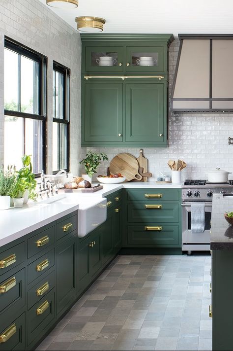 a kitchen with green cabinets and stone floors Green Kitchen Cabinets Tile Floor, Sage Kitchen Flooring Ideas, Green Kitchen Cabinets With Tile Floor, Green Kitchen With White Cabinets, Herringbone Floor Kitchen, Kitchen With Green Cabinets, Grey Tile Kitchen Floor, Concrete Kitchen Floor, Grey Kitchen Tiles