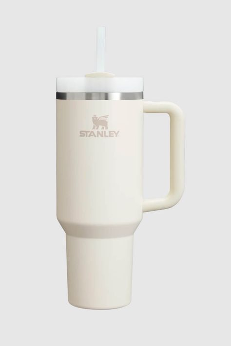 This Stanley Quencher H2.0 FlowState 40oz Travel Tumbler in Cream is just what you need for all-day hydration. Take it with you to a high-intensity workout or on an extra-long commute to keep your drink cold for hours. The lid features a rotating cover with three positions: a straw opening, a wide mouth for drinking, and a full-cover top to prevent spills. Features: Stanley Style: 10-10824-518 CREAM Color: Cream 90% Recycled 18/8 stainless steel, BPA-free Recycled stainless steel icon inside the tumbler indicates your Quencher is made from sustainable material Double-wall vacuum insulation Powder coat finish FlowState™ screw-on 3-position lid Reusable straw Comfort-grip handle Car cup holder compatible (base diameter: 3.1 inches) Dishwasher safe Dimensions: 3.86 L x 5.28 W x 12.3 H Cream Stanley Cup, Stanley Cup Mini, Stanley Cup Tumbler, Cream Stanley, Stanley Colors, Stanley Cream, Track Essentials, White Stanley, Cute Stanley