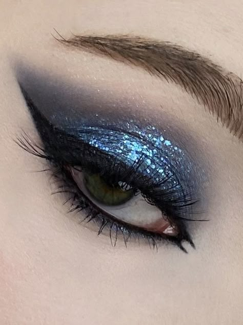 Blue Makeup Looks With Eyeliner, Steel Blue Eyeshadow, Navy Blue Homecoming Makeup, Blue Eyeshadow With Glitter, Dark Blue Euphoria Makeup, Blue Inspired Makeup Looks, Dark Blue Eyeshadow Aesthetic, Midnight Eye Makeup, Blue Glitter Eyeshadow Looks