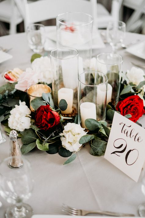 Wedding Decor Centerpieces Elegant, Red Flower Candle Centerpieces Wedding, Red And Eucalyptus Wedding, Red And White Rose Wedding Centerpieces, Elegant Wedding Red Roses, Wedding Centerpieces Red Roses, Red White Gold Centerpieces, Red And White Roses Wedding Decor, Red White And Black Centerpieces