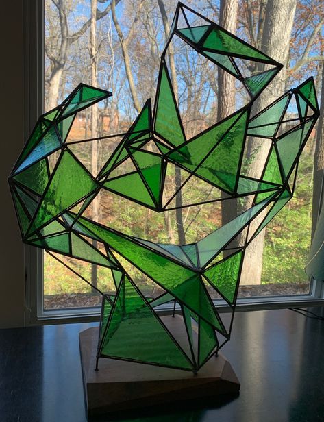 "Item: For your consideration we are presenting for sale an amazing and large vintage fused glass sculpture by artist, Richard Harris.  The piece is titled \"Greenpiece\", and it is formed from varying sized triangular green glass pieces that are fused together.  Dates back to the '90s.  Signed along the edge of one of the glass pieces, and there is also a card on the bottom of the wooden base (see photo).  It's truly a one-of-a-kind spectacular piece that we promise will make a statement wherever it ends up!  It'll make a fantastic addition to any modern interior setting.   NOTE: Additional photographs can be made available upon request. Measurements:  Approx. 29.75\" tall x 25\" wide.  The wood base that the sculpture rests on is approx. 12.5\" wide x 11.75\" deep x 1.5\" tall. Condition Glass Art Ideas, Sculpture Modern Art, Richard Harris, Sculpture Modern, Triangle Art, Geometric Sculpture, Stained Glass Diy, Stained Glass Designs, Stained Glass Projects