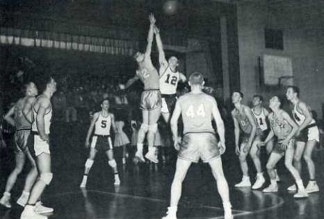 The jump ball at a basketball game held during the 1957-58 season.  The game was played in the old Bolivar High School gym.  Look closely and you will see fans sitting on the Bolivar stage. Adam Sandler Snl, George Mikan, Elgin Baylor, Rob Schneider, College Basketball Players, Jerry West, Ny Knicks, Basketball History, Kim Jong Un