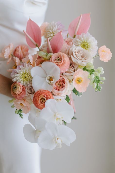 How gorgeous is this modern tropical wedding bouquet featuring white phalaenopsis orchids along with blush and soft coral touches! PC: @MeliaLucida Planning: @katyeroberts Bouquet: @bellabloommaui Orchids In Bouquets, Bride Bouquets Tropical, Lilac Tropical Wedding, Bridal Orchid Bouquet, Mexico Wedding Bouquet, Pastel Tropical Wedding, Tropical Fall Wedding, Wedding Bouquets With Orchids, Camellia Wedding Bouquet